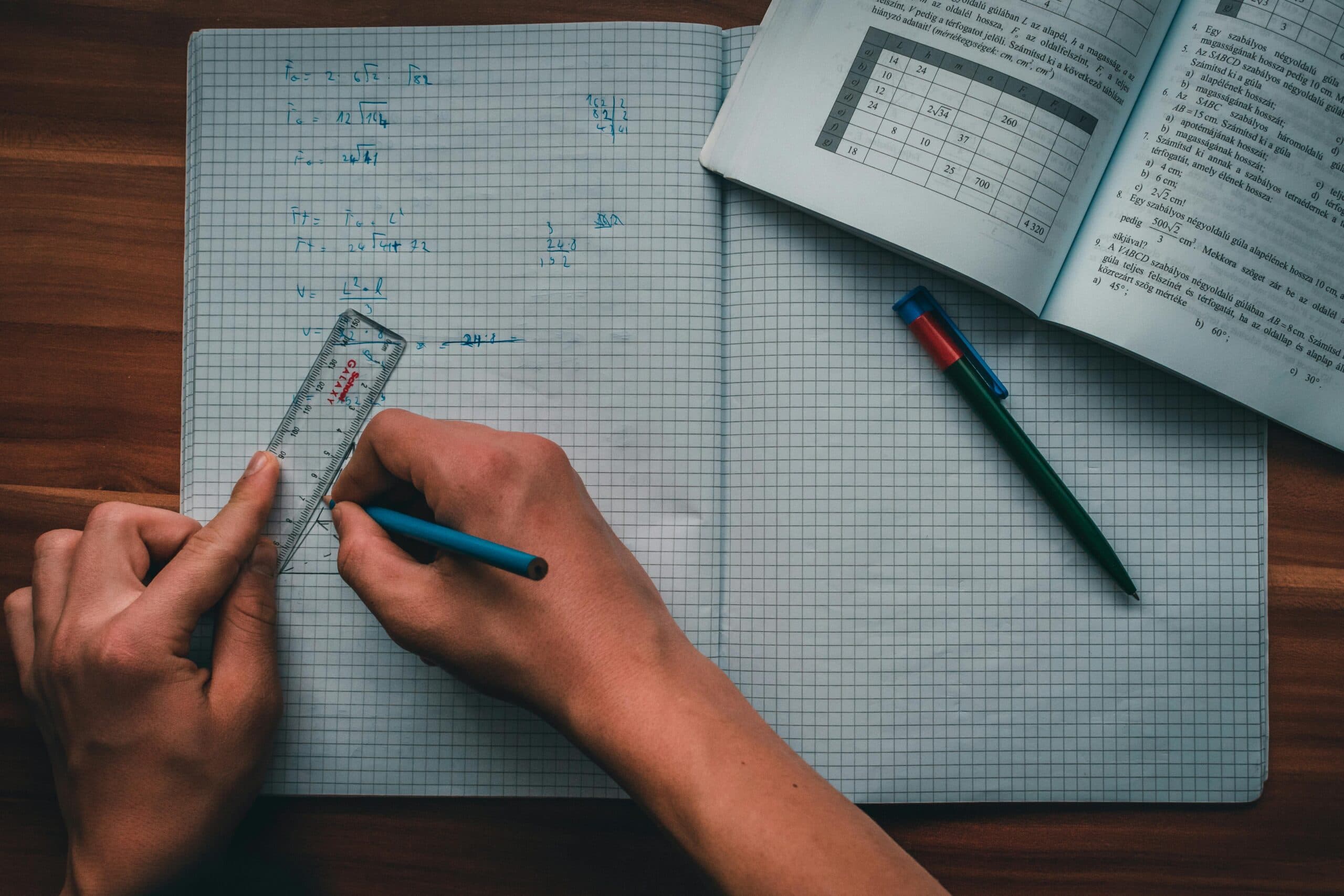 Mathematics notes and workbook on a study desk